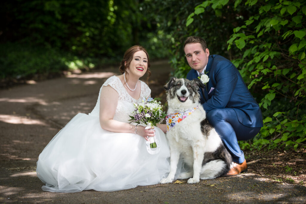 Bride and Groom with thir dog on their wedding day at Bowden Hall - Kathryn Goddard Photography