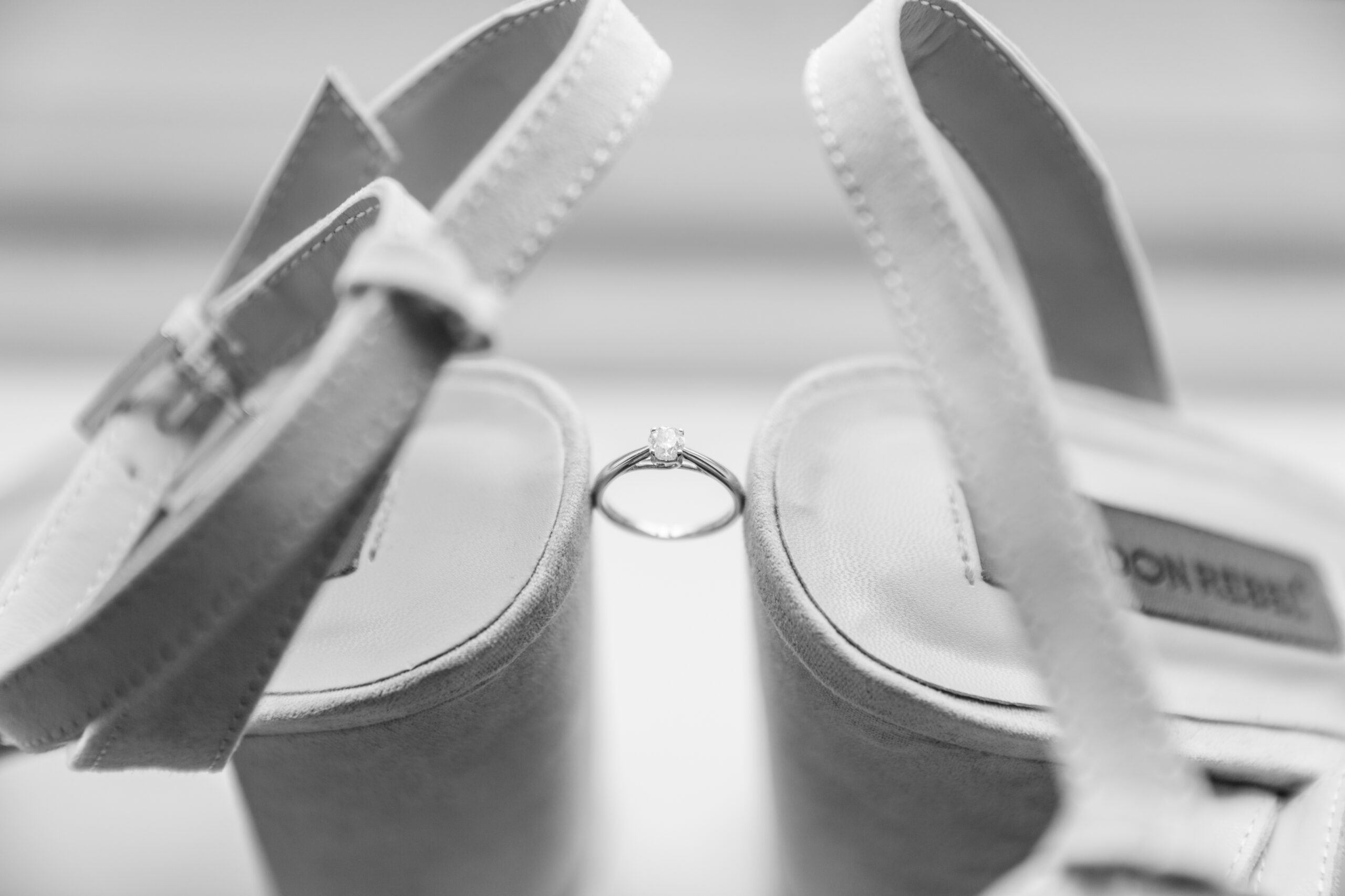 engagement ring with heeled shoes by Kathryn Goddard Photography