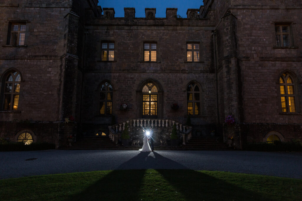 Clearwell Castle Wedding Venue at night by Kathryn Goddard Photography