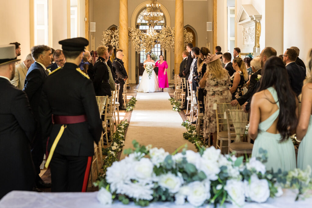 Walking down the aisle at Clearwell Castle