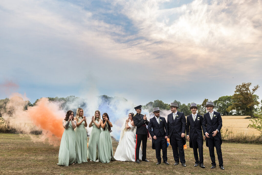 Wedding party with smoke bombs at Clearwell Castle